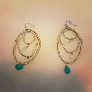 Gold earrings with blue stone detail
